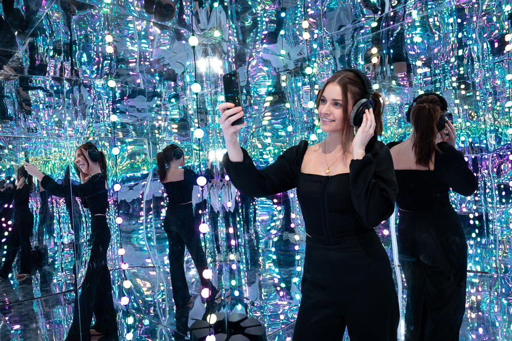 A woman taking a selfie at the Audible event